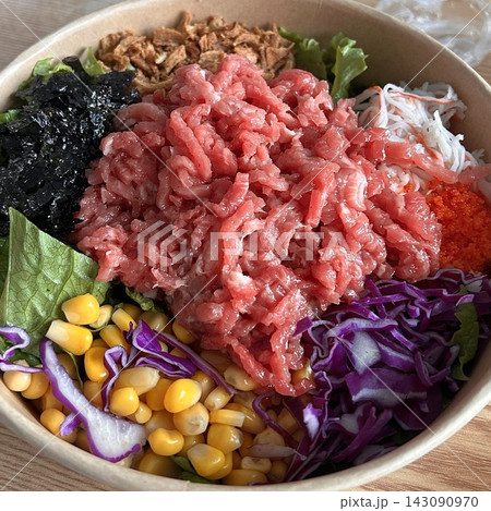 Fresh yukhoe poke with tender raw beef, vibrant vegetables, and a glossy seasoning. Clean, delicate, and flavorful, blending Korean freshness with a modern poke-style presentation. Fresh yukhoe poke with tender raw beef, vibrant vegetables, and a glossy seasoning. Clean, delicate, and flavorful, blending Korean freshness with a modern poke-style presentation. 143090970