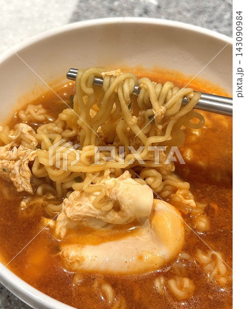 Shin Ramyun,close up of Ramyeon or Ramyun is a Korean-style soup noodle dish with a spicy flavor. Ramyeon or Korean instant noodles with egg - Korean food style Shin Ramyun,close up of Ramyeon or Ramyun is a Korean-style soup noodle dish with a spicy flavor. Ramyeon or Korean instant noodles with egg - Korean food style 143090984