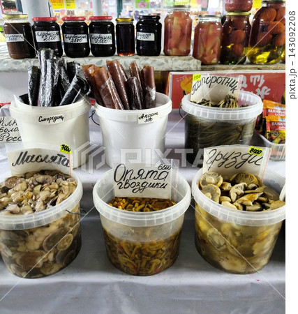 Homemade pickles and mushrooms at the grocery market 143092208