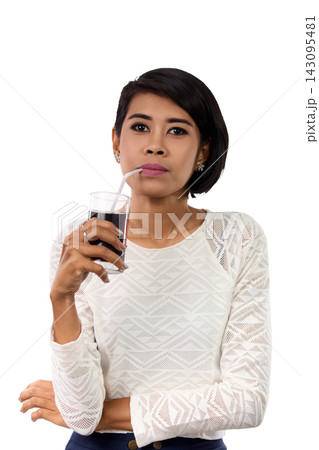 Emotional Asian Woman Drinking Cola in Studio Portrait 143095481