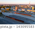 Aerial view of industrial yard at golden hour with freight trains 143095583