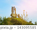Air defense radar. Military radar array mounted on truck chassis atop grassy hill. 143095585