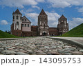 A view of the Mir Castle in Belarus from a old stone road. 143095753