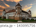 A view of the Mir Castle in Belarus at sunset. Red clouds 143095756