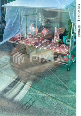 Open Air Meat Stall with Raw Cuts Under a Clear Plastic Canopy in Market Open Air Meat Stall with Raw Cuts Under a Clear Plastic Canopy in Market 143096183