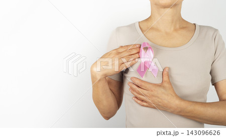 Caucasian Woman Holding Pink Breast Cancer Awareness Ribbon With Copy-Space 143096626
