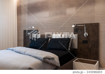 Contemporary Primary Bedroom With Upholstered Headboard and Neutral Bedding 143096803