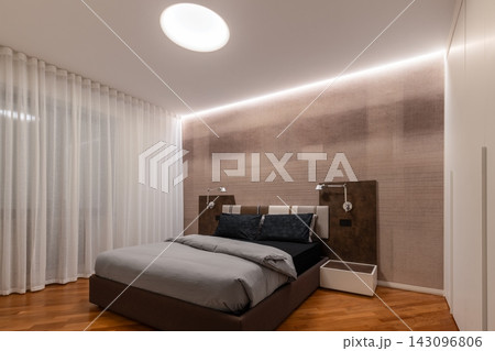 Italian Designed Bedroom with Circular Ceiling Recess and Sheer Curtains Italian Designed Bedroom with Circular Ceiling Recess and Sheer Curtains 143096806