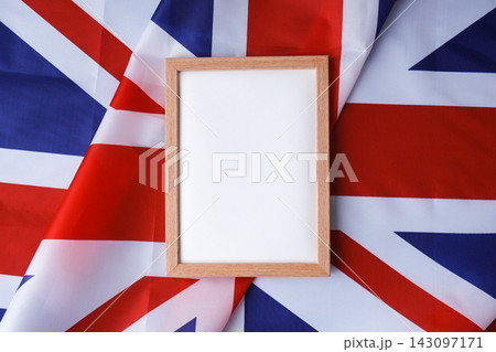 Empty white paper frame National symbol of Great Britain. Mock up advertisement template British wave UK fabric flag background. Copy space for your text. Independence 143097171