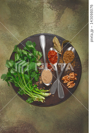 Georgian spices in spoons, on ketsi, top view, no people, Georgian spices in spoons, on ketsi, top view, no people, 143098076