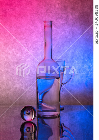 Still life with glass objects illuminated by blue and pink light Still life with glass objects illuminated by blue and pink light 143098388