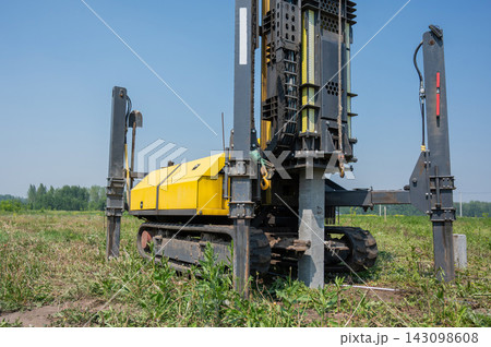 Diesel hammer drives concrete piles for a country house. Diesel hammer drives concrete piles for a country house. 143098608