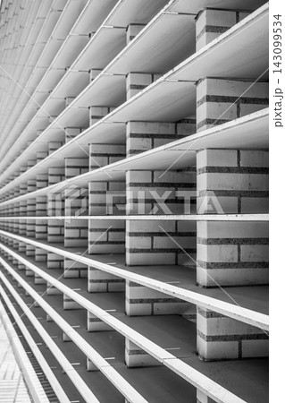 The image shows the unique architectural detail of the Parliament building in Vaduz, Liechtenstein. This structure features horizontal lines and brick elements that create a pattern. The image shows the unique architectural detail of the Parliament building in Vaduz, Liechtenstein. This structure features horizontal lines and brick elements that create a pattern. 143099534