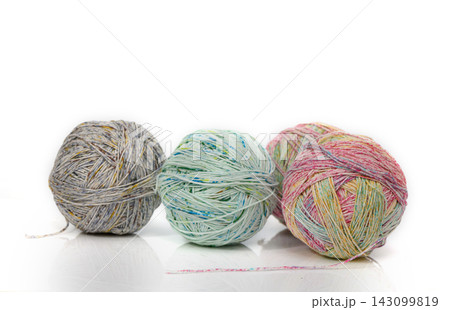 Colorful yarn balls create a vibrant display of textures and hues for crafting enthusiasts in a cozy studio setting Colorful yarn balls create a vibrant display of textures and hues for crafting enthusiasts in a cozy studio setting 143099819