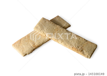 Two rectangular crispy wheat crispbread sticks on a white background Two rectangular crispy wheat crispbread sticks on a white background 143100149