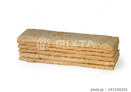 Stack of rectangular crispy wheat crispbread sticks on a white background Stack of rectangular crispy wheat crispbread sticks on a white background 143100201
