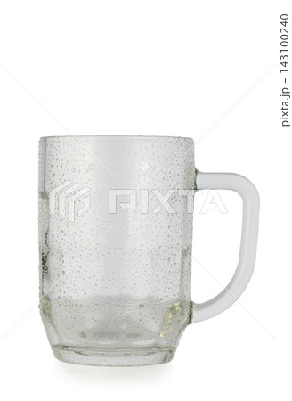 Wet empty faceted glass beer mug isolated on a white background 143100240