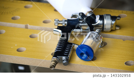 Professional airbrush gun with moisture trap for detailed painting and finishing projects Professional airbrush gun with moisture trap for detailed painting and finishing projects 143102958