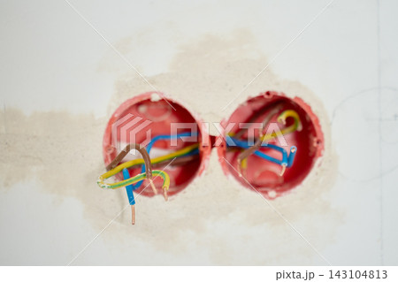 Exposed electrical wires in wall outlet boxes during home renovation 143104813