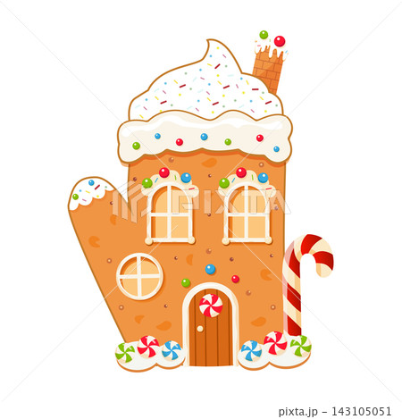 Mitten-shaped gingerbread house. Christmas cookie with sugar icing, a candy cane, and sprinkles, on a white background. Mitten-shaped gingerbread house. Christmas cookie with sugar icing, a candy cane, and sprinkles, on a white background. 143105051