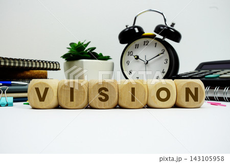 VISION alphabet letters with alarm clock and calculator on white background 143105958