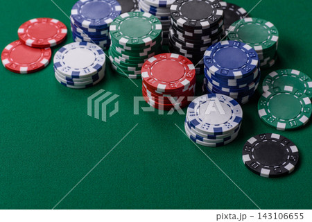 Multi colored gaming chips for betting in casino games. Betting chips 143106655
