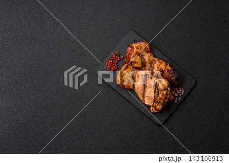 Grilled chicken breast seasoned with salt and spices. Grilled chicken 143106913