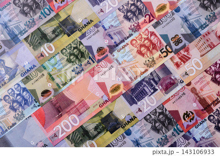 Ghana, Ghanaian paper money, cedi banknotes as currency for exchange or travel. Ghana money Ghana, Ghanaian paper money, cedi banknotes as currency for exchange or travel. Ghana money 143106933