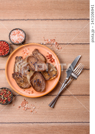 Slices of grilled pork or beef tongue seasoned with salt and allspice. Sliced beef tongue Slices of grilled pork or beef tongue seasoned with salt and allspice. Sliced beef tongue 143106941