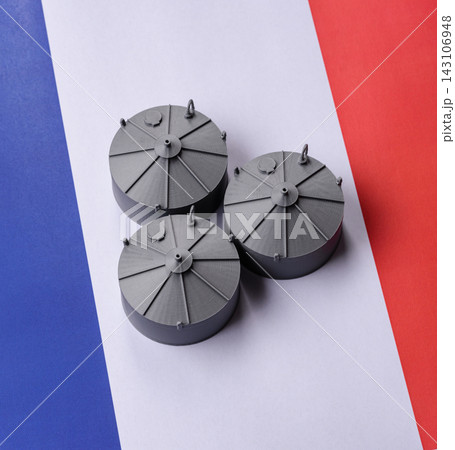 Liquefied gas storage tanks set against the French flag, representing the concept of supply Liquefied gas storage tanks set against the French flag, representing the concept of supply 143106948