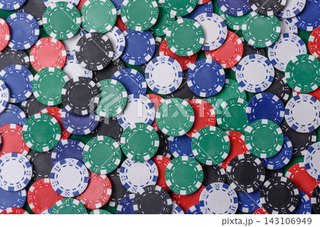 Multi colored gaming chips for betting in casino games. Betting chips Multi colored gaming chips for betting in casino games. Betting chips 143106949