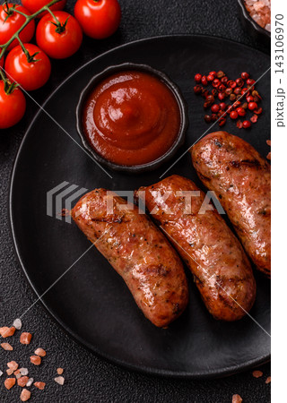Grilled chicken or pork sausages seasoned with salt and spices. Grilled sausages 143106970