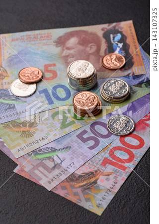 New Zealand paper money, dollar banknotes and cent coins as currency for exchange or travel New Zealand paper money, dollar banknotes and cent coins as currency for exchange or travel 143107325