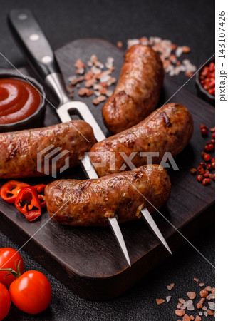 Grilled chicken or pork sausages seasoned with salt and spices. Grilled sausages 143107426