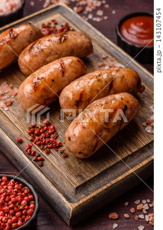 Grilled chicken or pork sausages seasoned with salt and spices. Grilled sausages 143107454