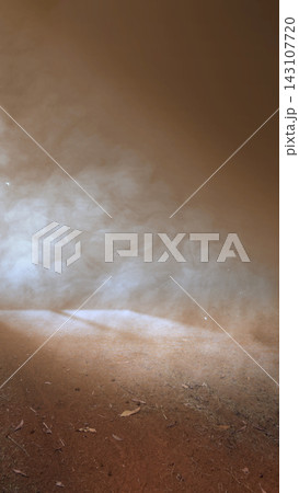 Sunlight beams shining through dust particles and smoke in a dark dusty room, creating an atmospheric and moody scene with warm earthy tones and visible air currents. Smoke background 143107720