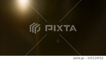 Anamorphic lens flare and light leak effect on dark background. Minimal cinematic optical texture ideal for overlays, film production, motion graphics and visual effects. 143110552