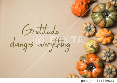 Decorative Pumpkins with Gratitude Message on Brown Background 143116083