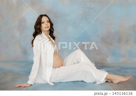Expectant Mother Embracing Pregnancy Journey Expectant Mother Embracing Pregnancy Journey 143116116