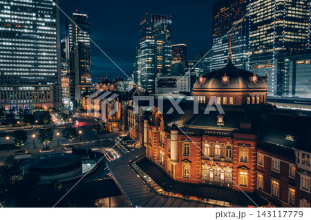 Historic Tokyo Station Illuminated among Modern Office Towers Historic Tokyo Station Illuminated among Modern Office Towers 143117779
