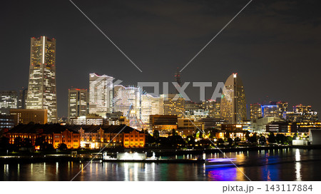 Minato Mirai Ferris Wheel Glowing among Waterfront Buildings Minato Mirai Ferris Wheel Glowing among Waterfront Buildings 143117884