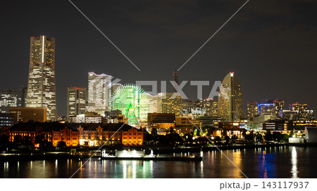 Historic Red Brick Warehouse and Modern Towers Illuminated across the Bay after Dark Historic Red Brick Warehouse and Modern Towers Illuminated across the Bay after Dark 143117937
