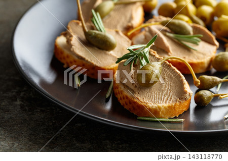 Sandwiches with pate on a black plate. Sandwiches with pate on a black plate. 143118770