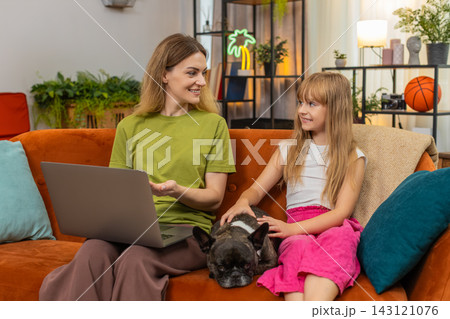Mother daughter dog start online study on laptop sit down together focus learn skill lesson teamwork Mother daughter dog start online study on laptop sit down together focus learn skill lesson teamwork 143121076