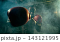 Intense boxer punches directly toward the viewer in a smoky industrial gym 143121995