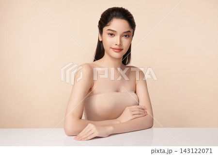 Beautiful Young transgender woman with clean fresh skin on beige background, Face care, Facial treatment, Cosmetology, beauty and spa, transgender women portrait. Beautiful Young transgender woman with clean fresh skin on beige background, Face care, Facial treatment, Cosmetology, beauty and spa, transgender women portrait. 143122071
