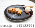 Apple strudel with vanilla ice cream and chocolate shavings in Tienen 143122591