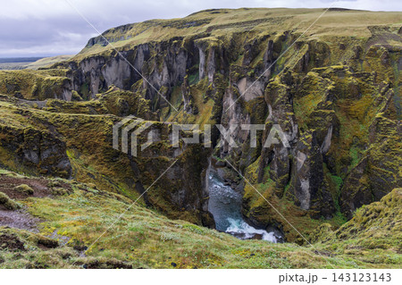 Fjadrargljufur canyon and Fjadra River beneath mossy cliffs in southern Iceland 143123143