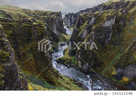 Fjadrargljufur canyon with Fjadra River winding between moss covered cliffs 143123146