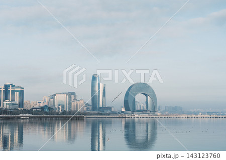 View of Baku embankment and Crescent Hotel by the sea in Azerbaijan at different times of the day View of Baku embankment and Crescent Hotel by the sea in Azerbaijan at different times of the day 143123760